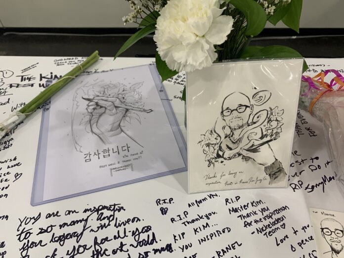 art, flowers, and notes left on Kim Jung Gi's table